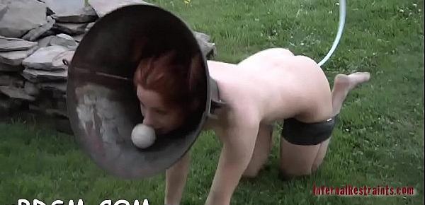  Slave has to wear a metal cage helmet  during muff torturing